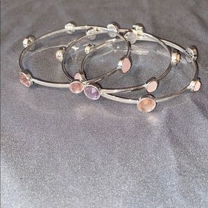 3 bracelets with pink jewels